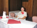 Coordinator Assistant - Patricia Monsinger-Norman waits to greet guests at the front entrance to the Officer's Club.